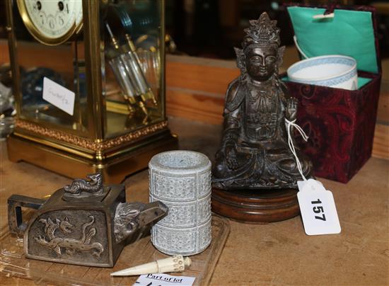 Bronze figure of a Buddha, painted eggshell porcelain beaker in box, jade cylinder and white metal water dropper and hardwood stand